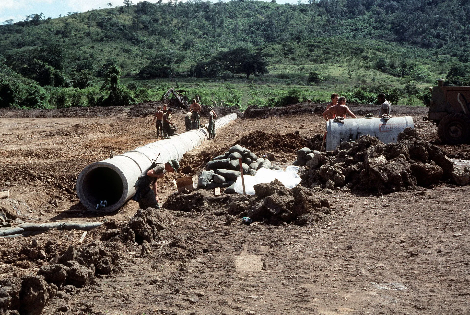 Drainage trench and pipe being installed to carry runoff away from a home in Benton County